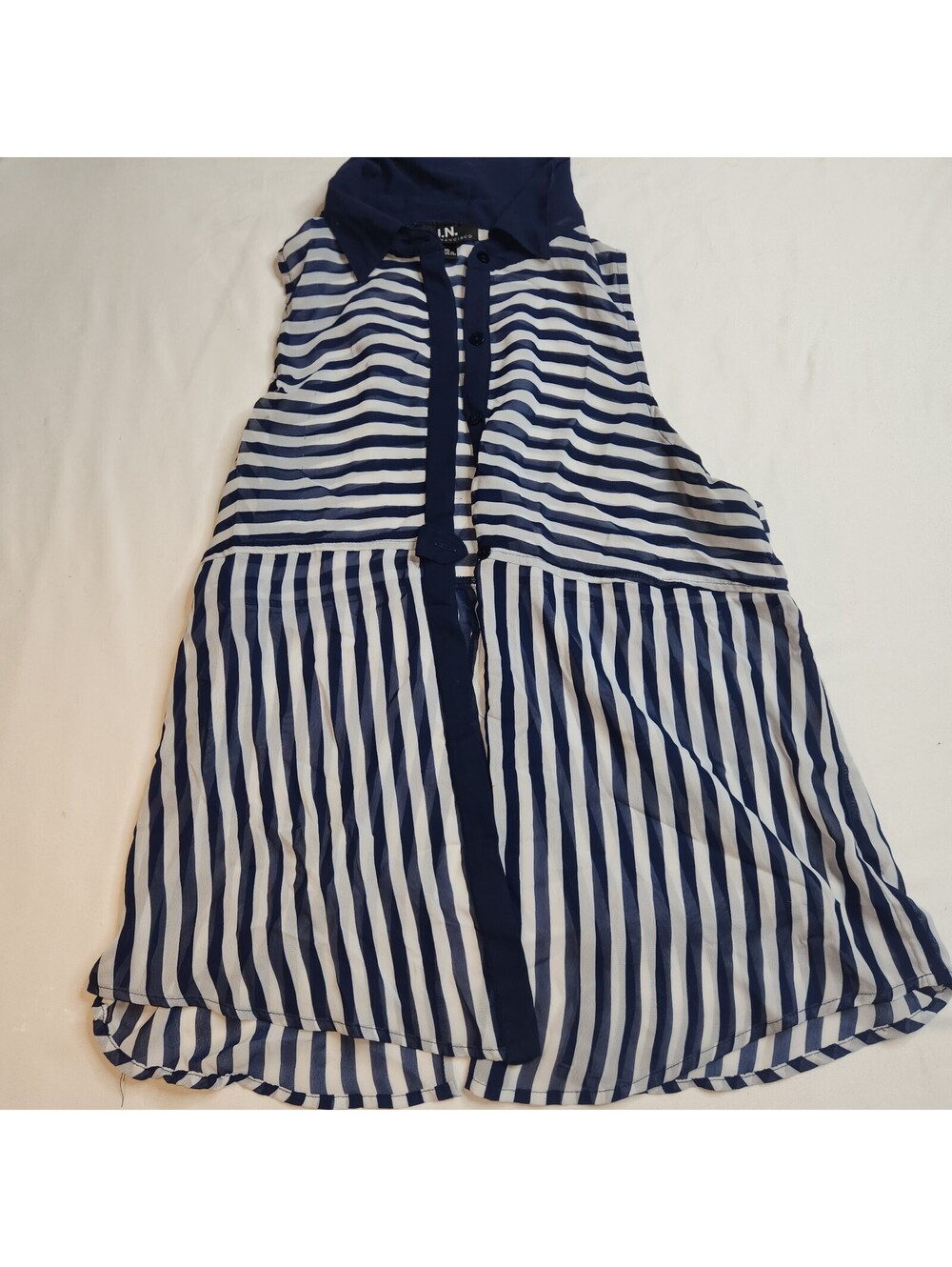 Blue and white striped sleeveless blouse